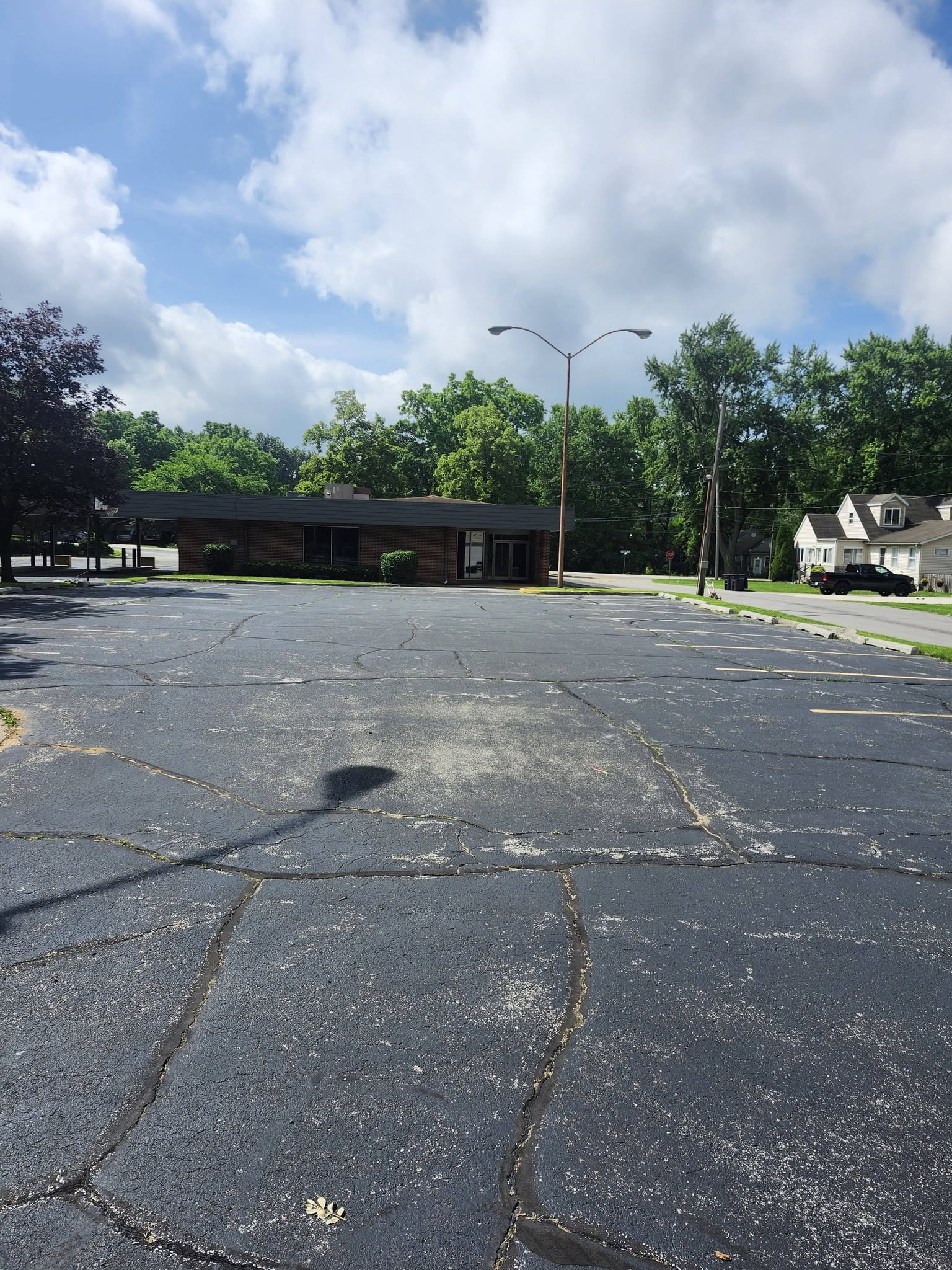 Weathered asphalt with visible cracking